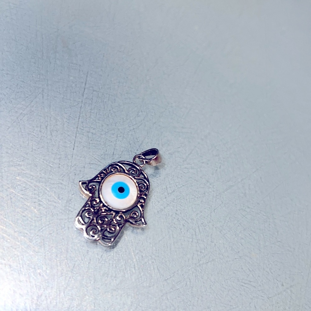 Sterling silver Evil Eye pendant with mother of pearl and turquoise stone center